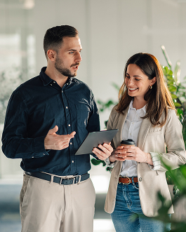 Two people discussing with a tablet.
