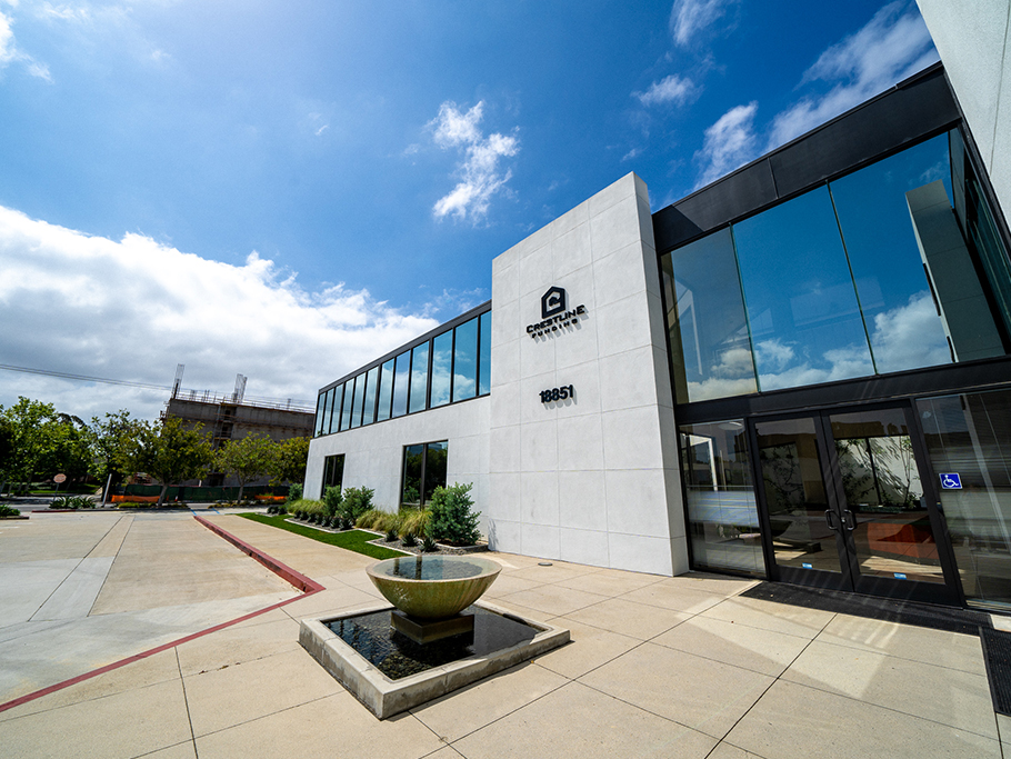 White building with reflective glass on a sunny day