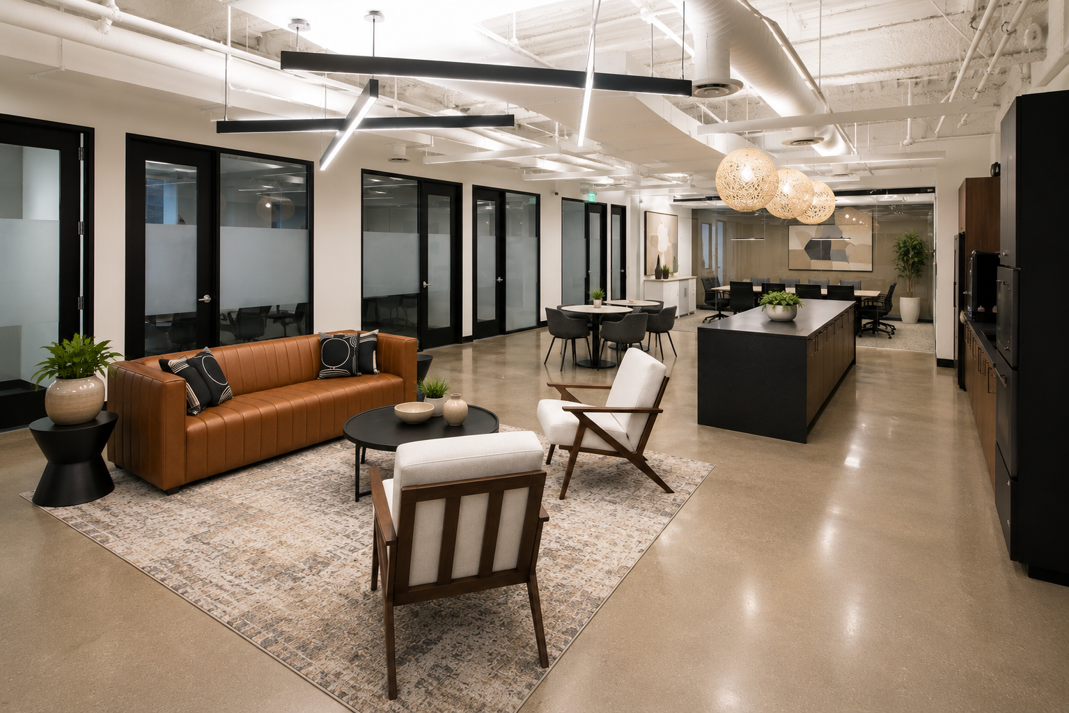 Modern office lobby and business lounge with comfortable seating, collaborative areas, private office entrances, and a shared kitchen.