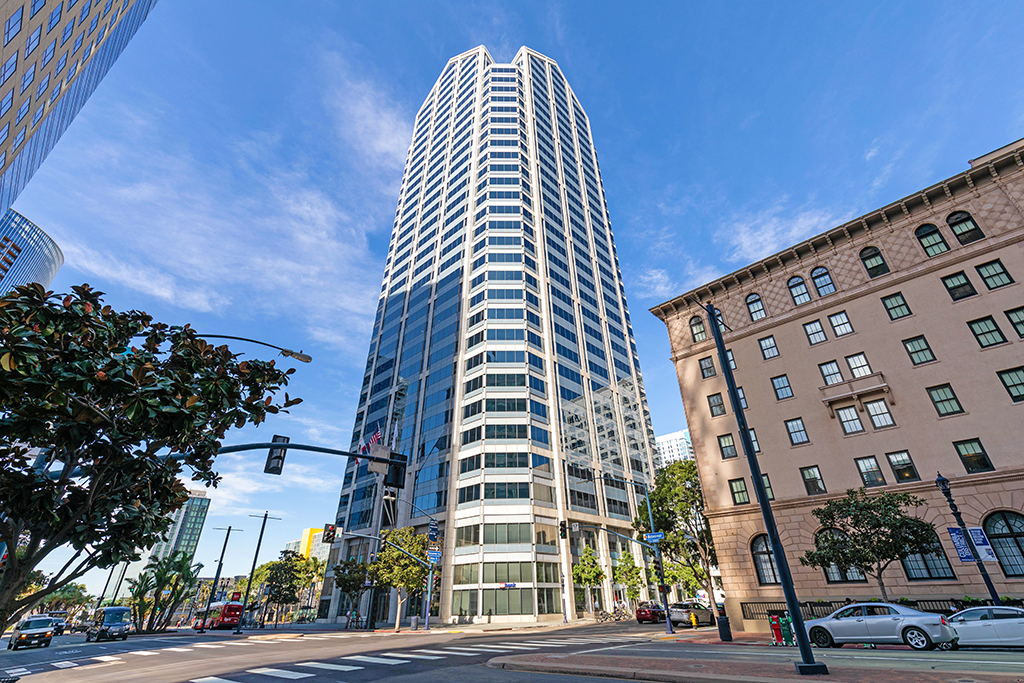 Modern skyscraper beside historic building