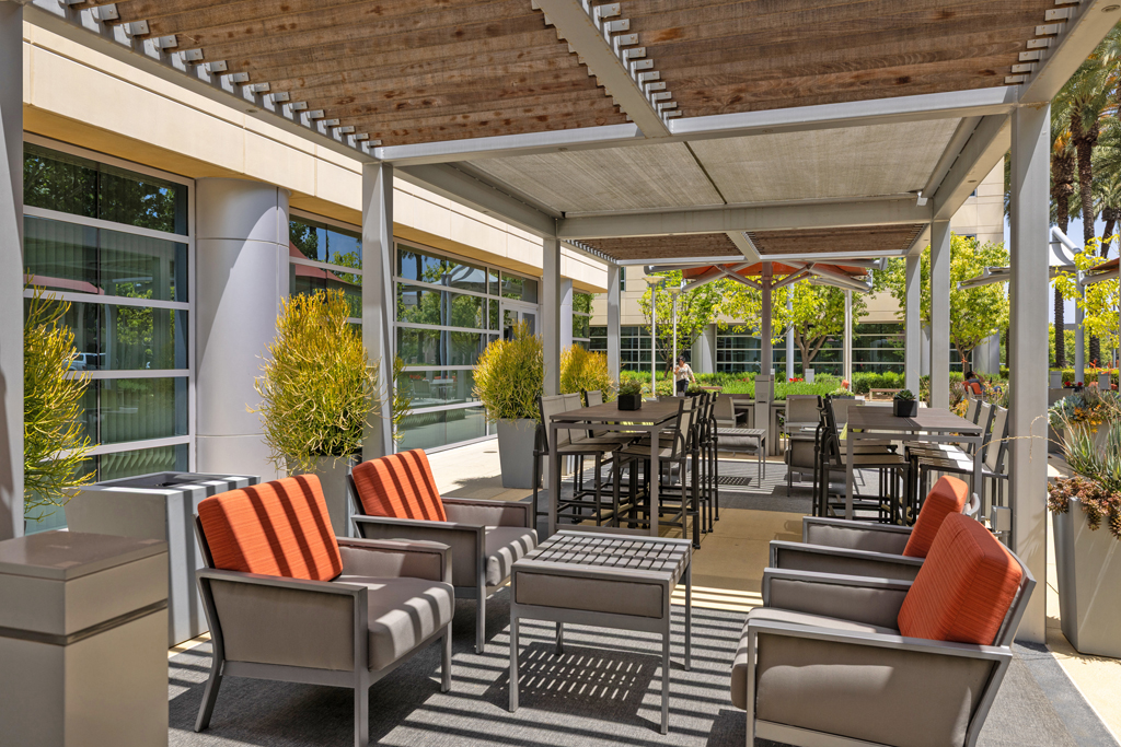 Modern outdoor seating area with greenery