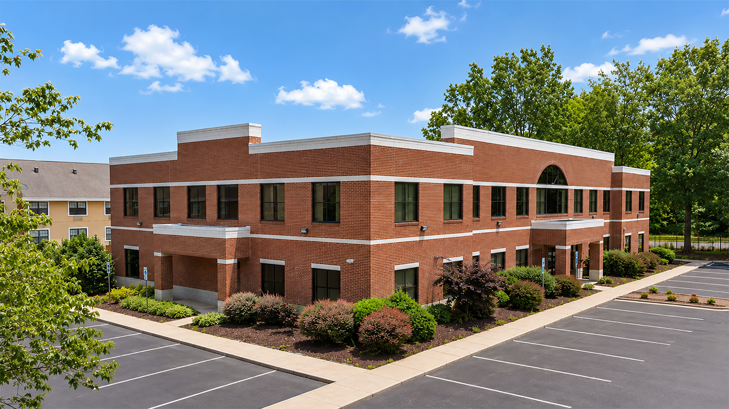 Brick Building surrounded by foliage