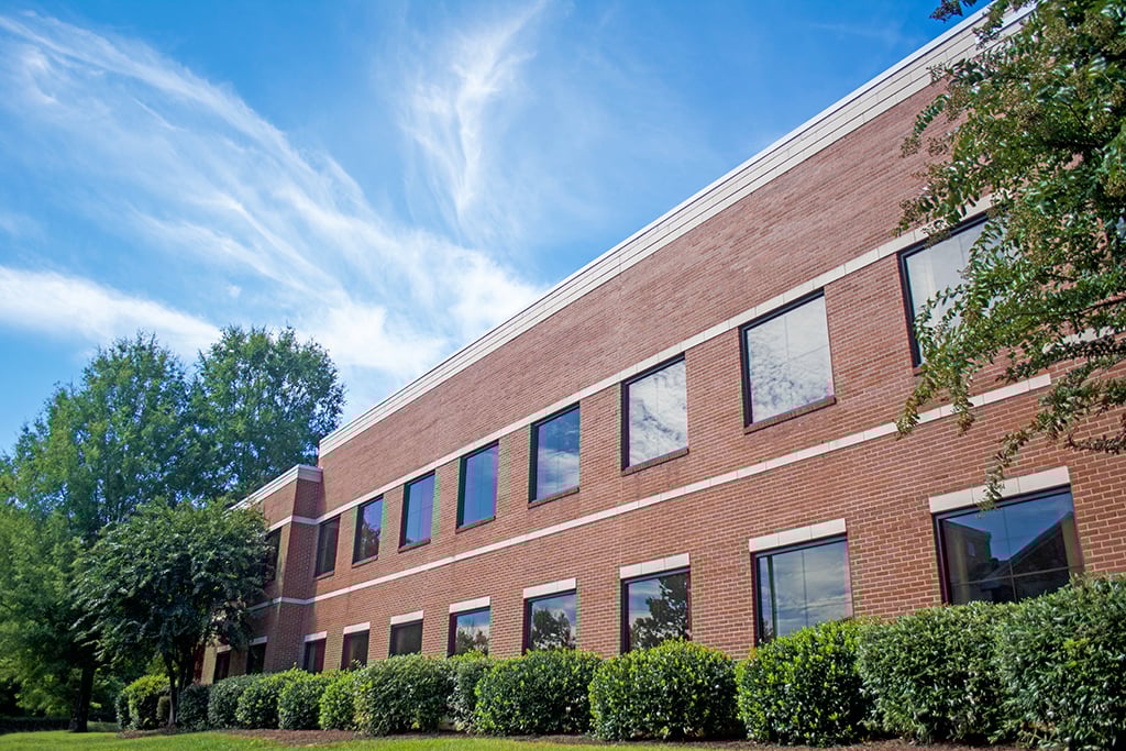 Modern brick building with greenery