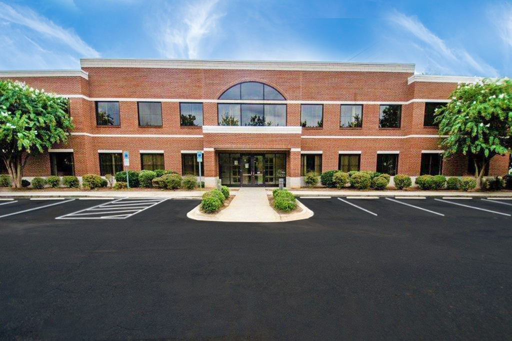 Modern brick building with parking lot