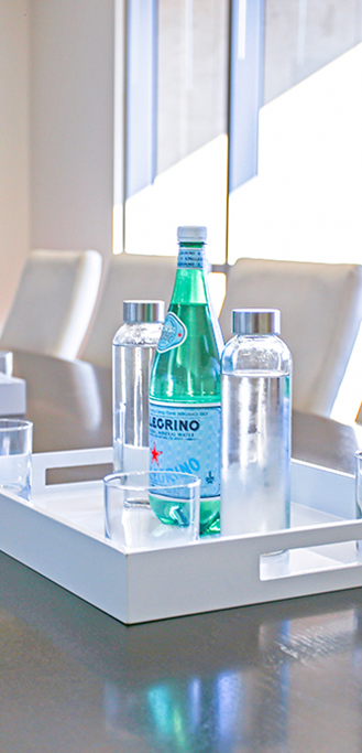Bottles of water on white tray