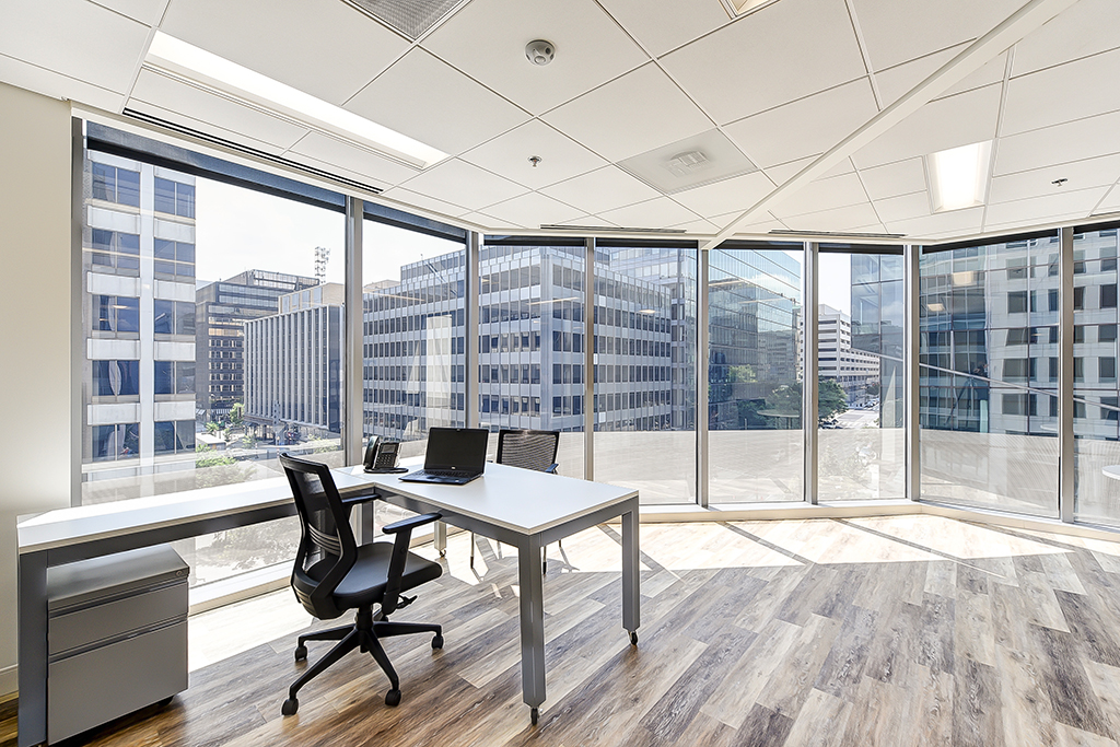 Modern office with large windows.