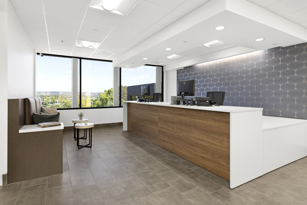 Modern reception area with floor to ceiling windows and seating