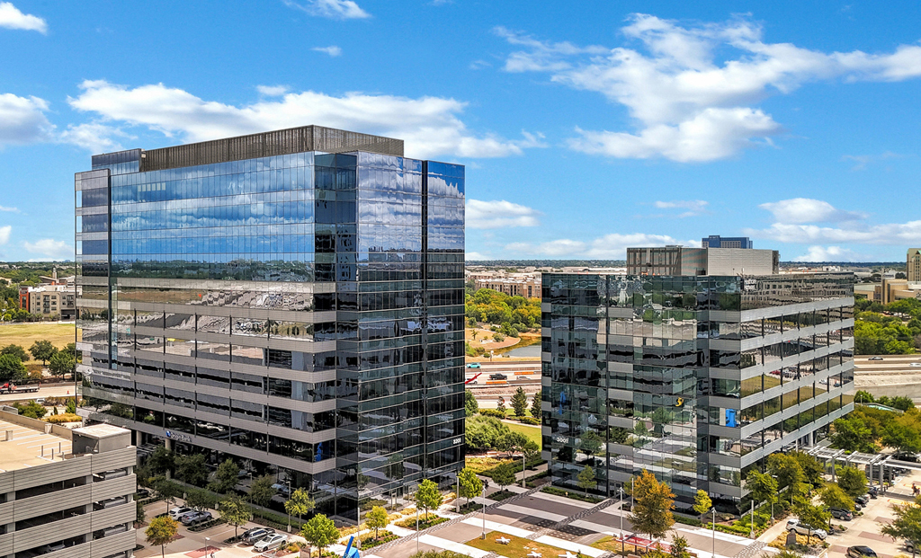 Modern glass buildings under blue sky