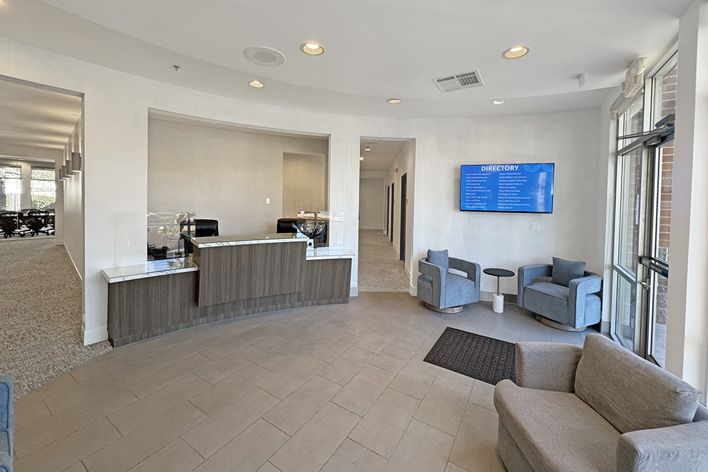 Modern reception area with seating.