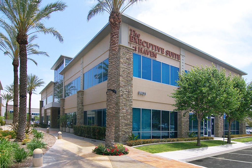 Modern office building with palm trees