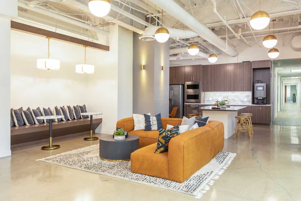 Modern lounge with kitchen area.