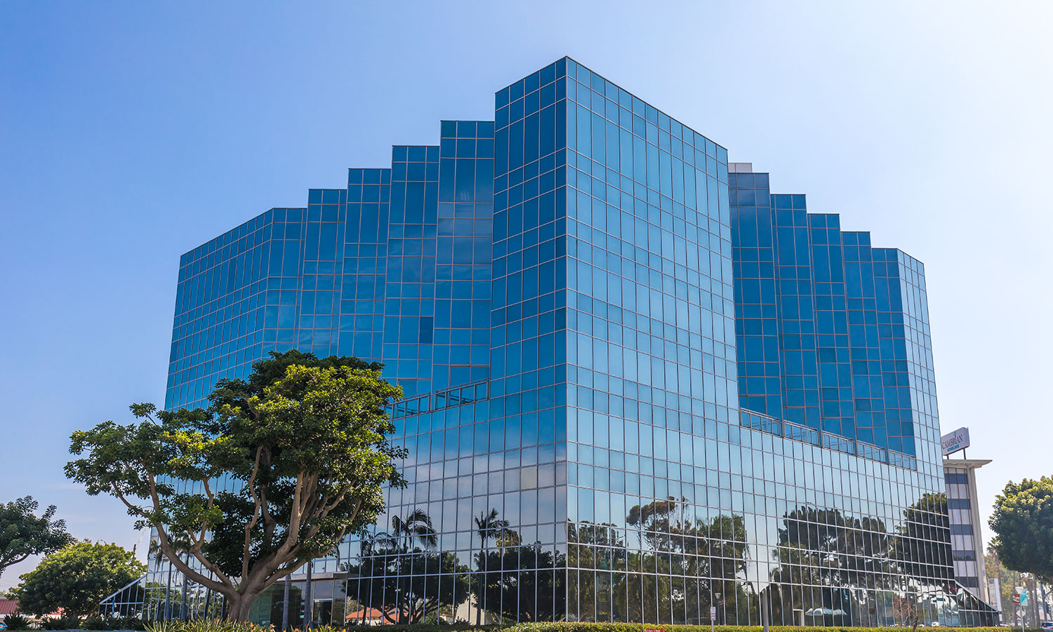 Modern glass building with blue reflections