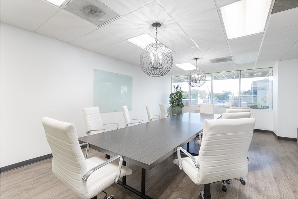 Modern conference room with white chairs