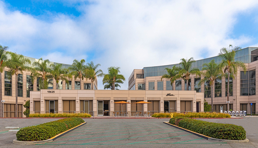 Modern office building with palm trees