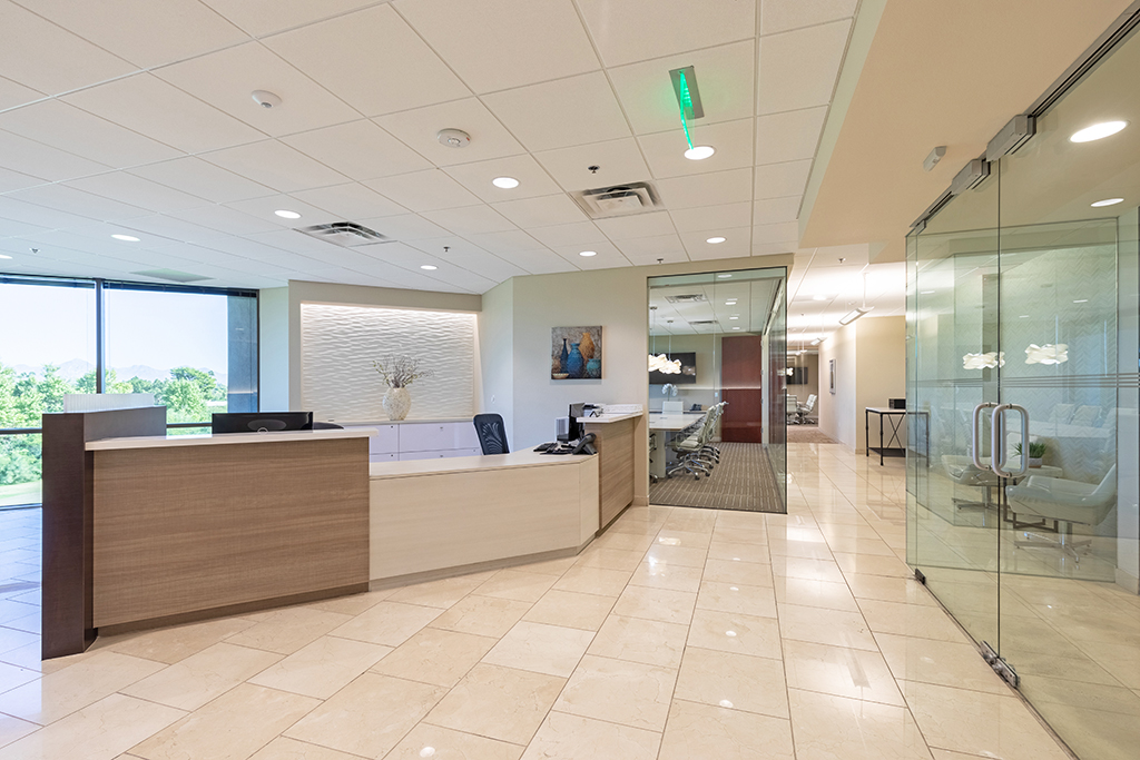Modern office reception area with glass