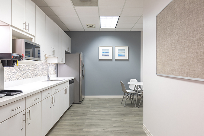 Kitchen with wood floor and white cabinet