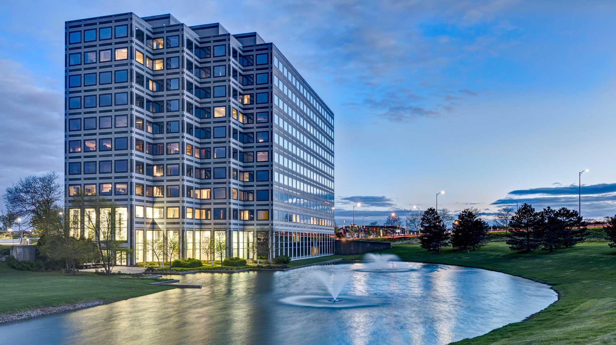 Modern office building by a pond