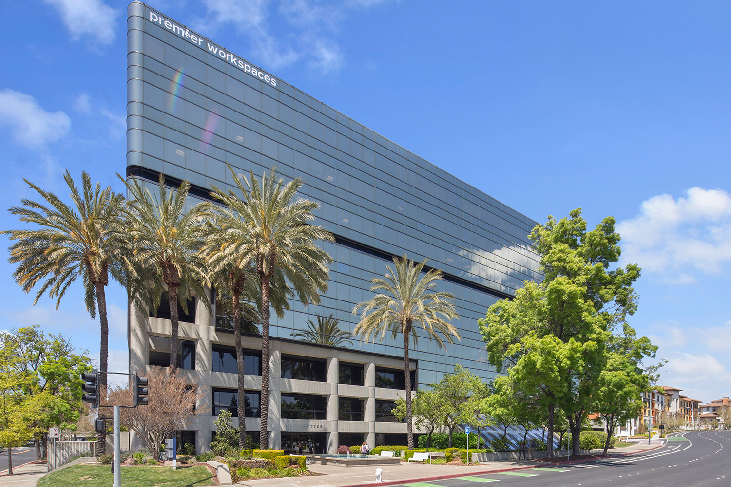 Modern office building with palm trees