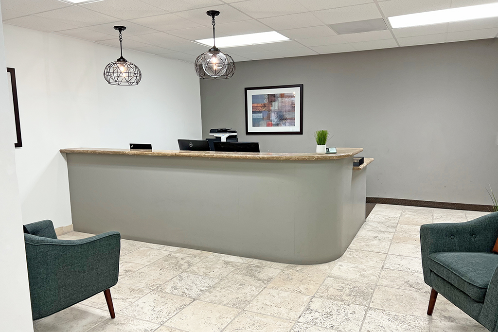 Modern reception area with seating.