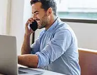 Man on a telephone in a private office