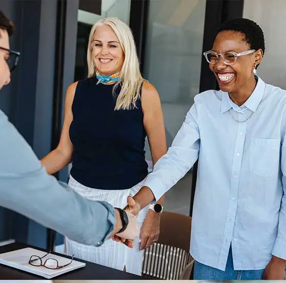 Two women touring an office