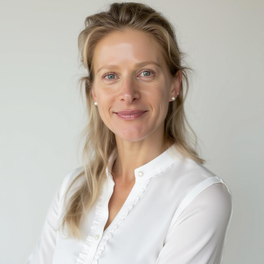 Woman in white blouse, neutral background.