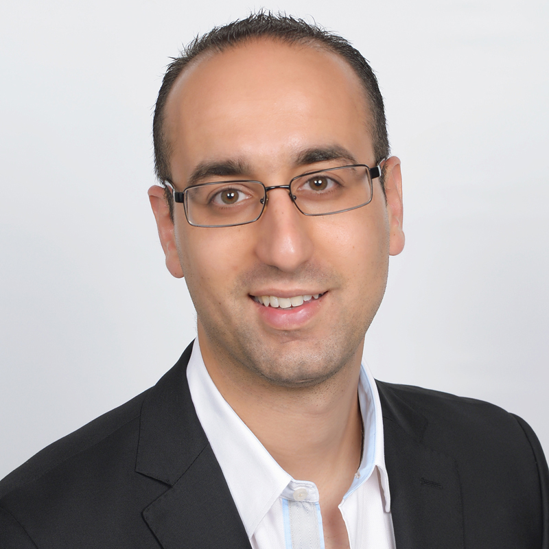 Man in suit, professional appearance.