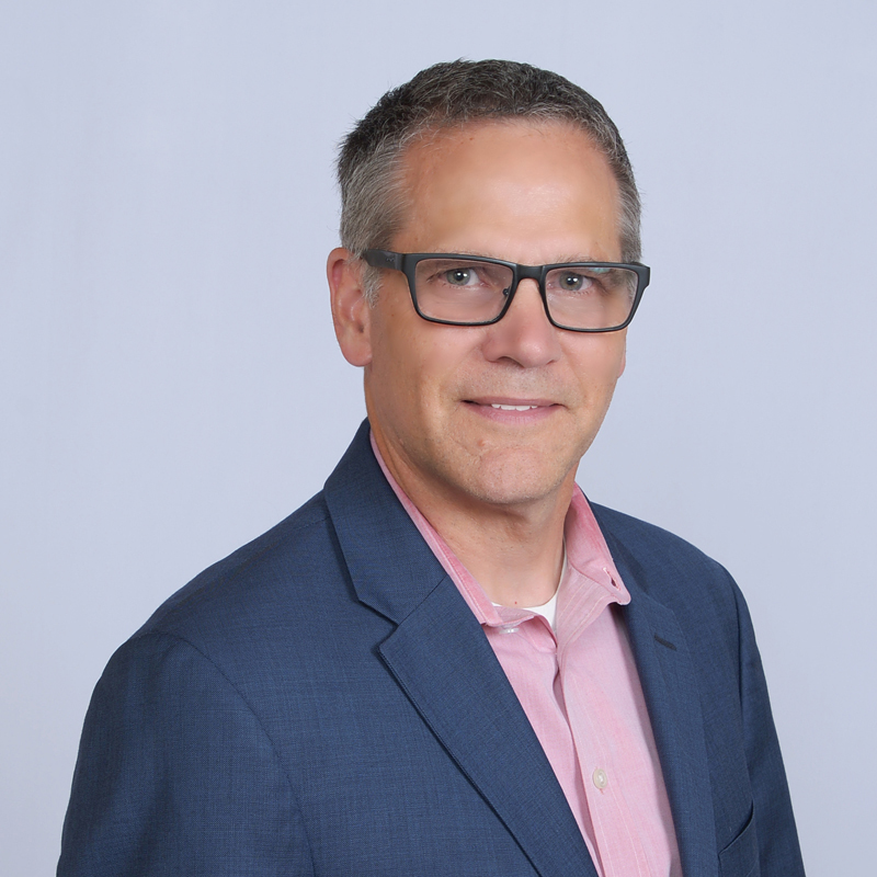 Man in suit with light shirt