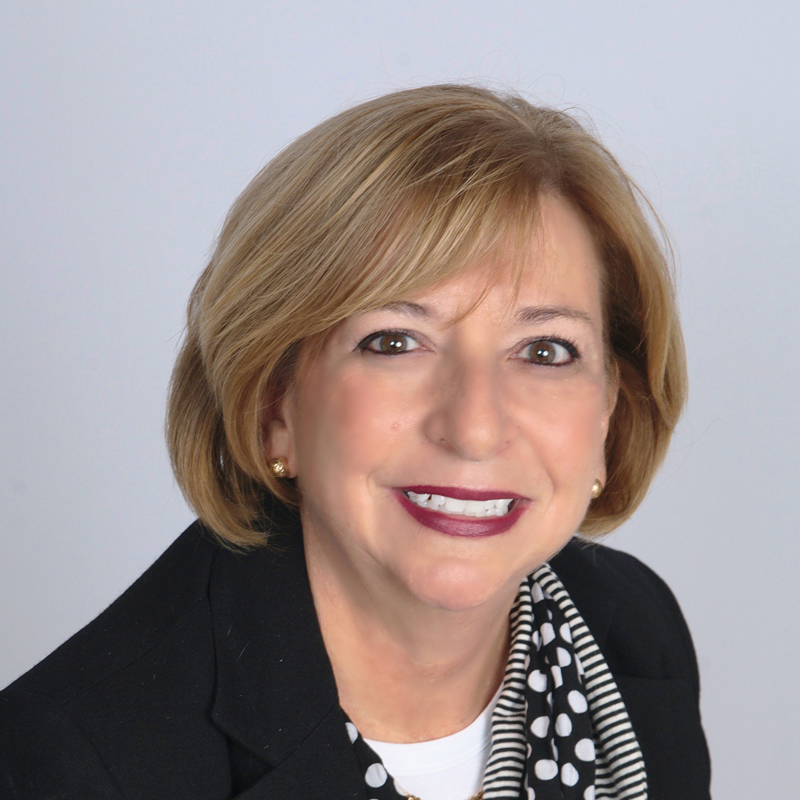 Woman with blonde hair and scarf